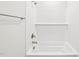 Bright white bathroom featuring a shower/tub combo with tile surround and chrome fixtures at 2207 Cherry Creek Rd, Haw River, NC 27258