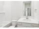Clean bathroom featuring a vanity with modern sink, mirror, and shower-tub combo at 2207 Cherry Creek Rd, Haw River, NC 27258