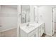 Bright bathroom with double vanity, large mirrors, and a glass enclosed shower at 2207 Cherry Creek Rd, Haw River, NC 27258