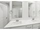The modern bathroom has a double vanity with two mirrors and good lighting at 2207 Cherry Creek Rd, Haw River, NC 27258
