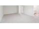 Spacious bedroom leading to bathroom shows neutral carpeting and abundant natural light at 2207 Cherry Creek Rd, Haw River, NC 27258
