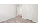 Bright and open bedroom featuring neutral walls, sleek flooring, and modern doors at 2207 Cherry Creek Rd, Haw River, NC 27258