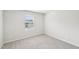 Bright bedroom with a window providing natural light and neutral carpeting at 2207 Cherry Creek Rd, Haw River, NC 27258