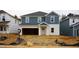New construction home with blue and white siding and an unfinished front yard at 2207 Cherry Creek Rd, Haw River, NC 27258