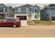 Charming two-story home with blue and white siding and an attached two-car garage at 2207 Cherry Creek Rd, Haw River, NC 27258