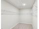A practical walk-in closet features ample shelving for maximum storage efficiency at 2207 Cherry Creek Rd, Haw River, NC 27258