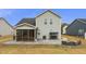 Large backyard features patio, screened porch, swing and outdoor seating area at 235 Mallard Loop Dr, Clayton, NC 27527