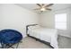Neutral bedroom featuring a ceiling fan, carpet, a bright window and comfortable bed at 235 Mallard Loop Dr, Clayton, NC 27527