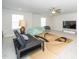Bonus room with ceiling fan, neutral carpet, bright natural light, and comfortable seating for recreation at 235 Mallard Loop Dr, Clayton, NC 27527