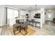 Eat-in kitchen featuring a large island, white cabinets, and seating for seven at 235 Mallard Loop Dr, Clayton, NC 27527
