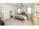 Spacious main bedroom suite featuring a neutral color palette, natural light, and luxurious finishes at 235 Mallard Loop Dr, Clayton, NC 27527