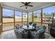 Relaxing screened porch with comfortable seating and views of the landscaped yard at 235 Mallard Loop Dr, Clayton, NC 27527