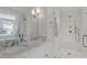 Luxurious bathroom with marble countertops, double sinks, and a modern glass-enclosed shower at 2714 Gordon St, Raleigh, NC 27608