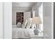 Cozy bedroom featuring a spacious closet, soft lighting, and a comfortable bed at 2714 Gordon St, Raleigh, NC 27608
