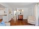 Bright entryway featuring hardwood floors, a classic wood dresser, and elegant decor at 2714 Gordon St, Raleigh, NC 27608