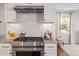 Bright kitchen featuring stainless steel appliances, quartz countertops, and open layout at 2714 Gordon St, Raleigh, NC 27608