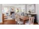 Open living and dining area with hardwood floors, fireplace, and natural light at 2714 Gordon St, Raleigh, NC 27608