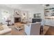 Bright living room featuring a brick fireplace and built-in shelving, perfect for cozy evenings at 2714 Gordon St, Raleigh, NC 27608