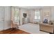 Cozy living room with large windows, hardwood floors, and comfortable seating arrangement at 2714 Gordon St, Raleigh, NC 27608