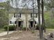 Inviting two-story duplex with black shutters and a wooded front yard at 309 Watson St # A/B, Creedmoor, NC 27522