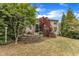 Home with a stone firepit area with a wooded area behind it at 317 Briarfield Dr, Apex, NC 27502
