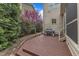 Home's backyard features a wooden deck, grill, and beautiful greenery at 317 Briarfield Dr, Apex, NC 27502