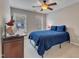 Cozy bedroom featuring carpet, neutral walls, two windows and simple furnishings at 317 Briarfield Dr, Apex, NC 27502