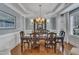 Elegant dining room featuring hardwood floors, chandelier, and sophisticated wall decor at 317 Briarfield Dr, Apex, NC 27502