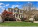 Charming two-story home featuring a manicured lawn and inviting front porch at 317 Briarfield Dr, Apex, NC 27502