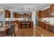 Well-designed kitchen with island, stainless appliances, custom cabinets and hardwood floors at 317 Briarfield Dr, Apex, NC 27502