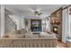 Spacious living room with stone fireplace, built-ins, and staircase at 317 Briarfield Dr, Apex, NC 27502