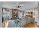 Comfortable living room with a stone fireplace, hardwood floors, and access to the kitchen at 317 Briarfield Dr, Apex, NC 27502