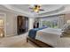 Bright main bedroom with large windows, neutral walls, carpet and a spacious walk-in closet at 317 Briarfield Dr, Apex, NC 27502