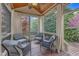 The porch features gray cushioned chairs and overlooks an abundant green space at 317 Briarfield Dr, Apex, NC 27502