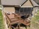 A multi-level back deck and screened porch, perfect for outdoor living and entertaining at 3220 Brassfield Rd, Creedmoor, NC 27522