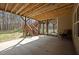 Backyard patio featuring wooden stairs, perfect for outdoor enjoyment and relaxation in the beautiful landscape at 3220 Brassfield Rd, Creedmoor, NC 27522