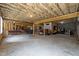 Unfinished basement offering ample space and potential for customization, including living and storage areas at 3220 Brassfield Rd, Creedmoor, NC 27522