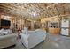 Unfinished basement with sofas, cabinets, and space for entertainment at 3220 Brassfield Rd, Creedmoor, NC 27522