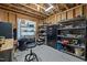 Unfinished basement area with shelving and storage solutions at 3220 Brassfield Rd, Creedmoor, NC 27522