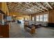 Spacious basement area featuring living space with sofas and a pool table, perfect for entertaining and relaxation at 3220 Brassfield Rd, Creedmoor, NC 27522