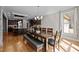Bright dining room features hardwood floors and ample space for hosting gatherings at 3220 Brassfield Rd, Creedmoor, NC 27522