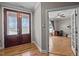 Inviting foyer with hardwood floors and a view into a home office at 3220 Brassfield Rd, Creedmoor, NC 27522