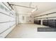 Spacious two car garage with shelving and rolling tool chests at 3220 Brassfield Rd, Creedmoor, NC 27522