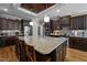 Gourmet kitchen boasts a large island with granite countertops and stainless steel appliances at 3220 Brassfield Rd, Creedmoor, NC 27522