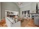 Spacious living room with a fireplace and an open layout to the kitchen and dining areas at 3220 Brassfield Rd, Creedmoor, NC 27522