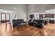 Open-concept living room with hardwood floors and a seamless flow to the kitchen at 3220 Brassfield Rd, Creedmoor, NC 27522