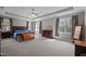 Spacious main bedroom with tray ceiling and large windows at 3220 Brassfield Rd, Creedmoor, NC 27522