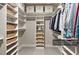 Organized walk-in closet with ample shelving and hanging space at 3220 Brassfield Rd, Creedmoor, NC 27522
