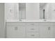 Bathroom with a double vanity, white cabinets and bright countertop at 3849 Rosebush Dr, Zebulon, NC 27597