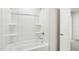 Bright white bathtub and shower combination featuring clean design at 3849 Rosebush Dr, Zebulon, NC 27597
